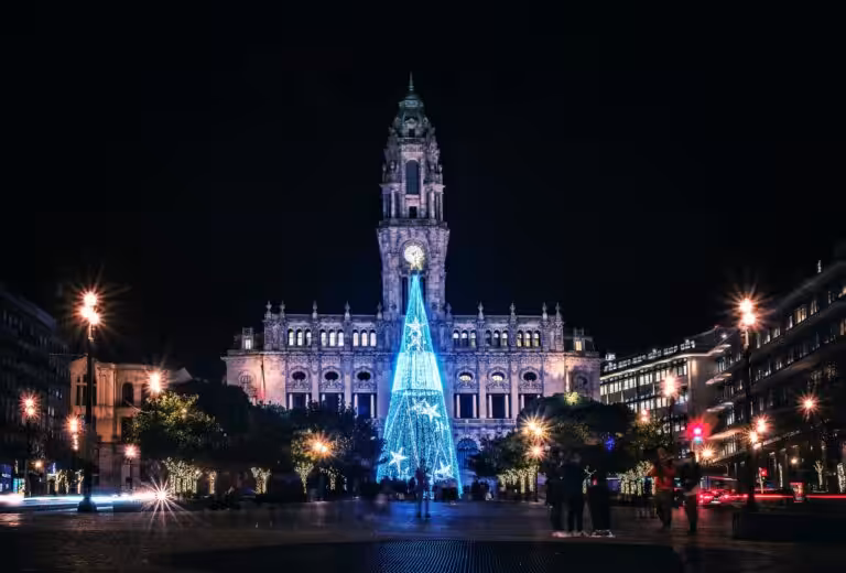Porto's Christmas tree lit up in front of the City Hall at the top of Avenida dos Aliados at night